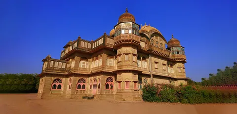 Vijay Vilas Palace at Mandvi, a sandstone palace with domes, jharokha balconies and pink-arched windows